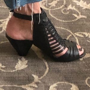 Vince Camuto black leather, strappy sandals with block heels.